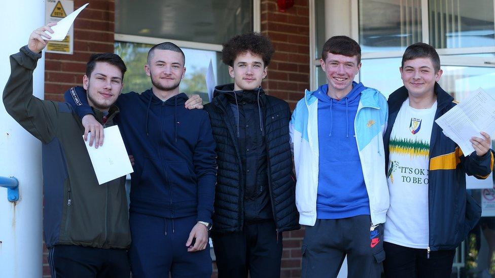 Five boys celebrate their GCSE results