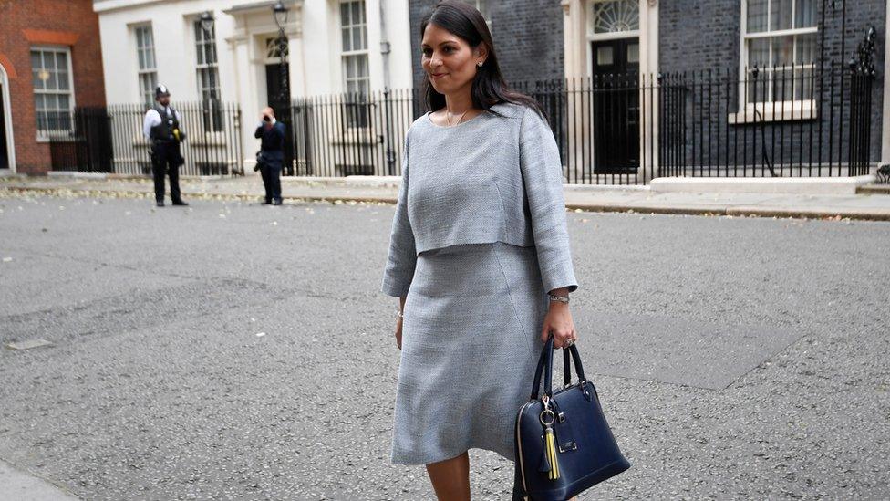 Britain"s Home Secretary Priti Patel walks outside Downing Street in London