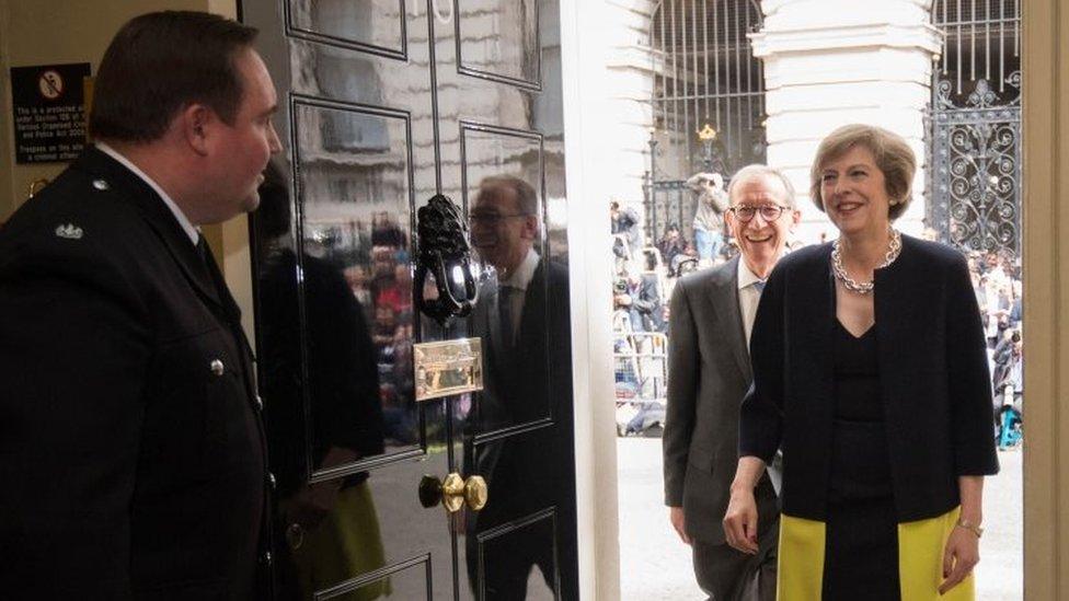 Theresa May and husband Philip enter No 10