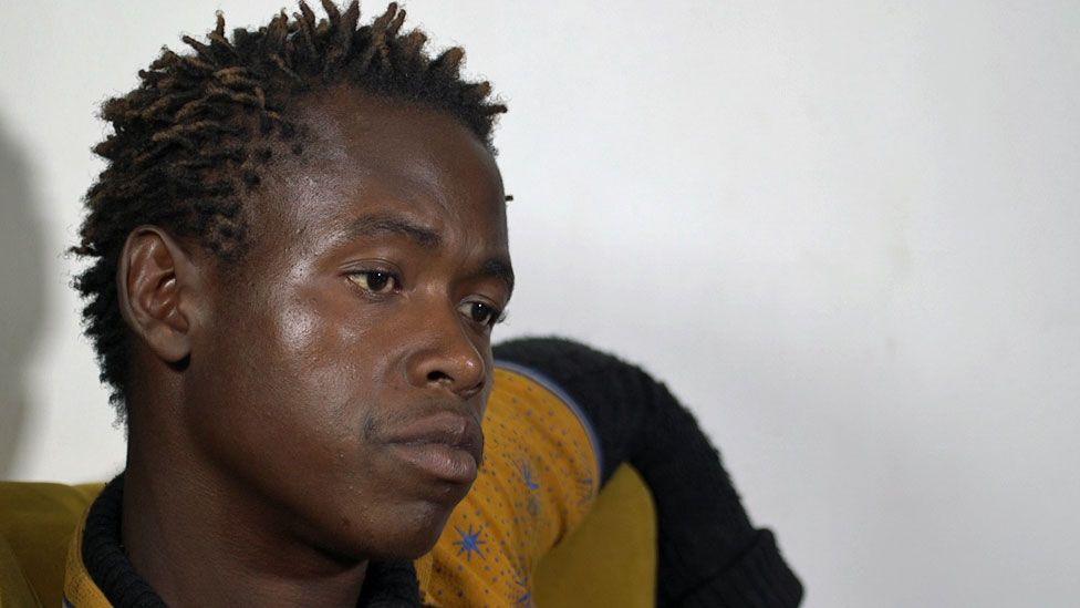 Mayamiko Mwape pictured during his interview with the BBC, with his hair in twists and looking serious