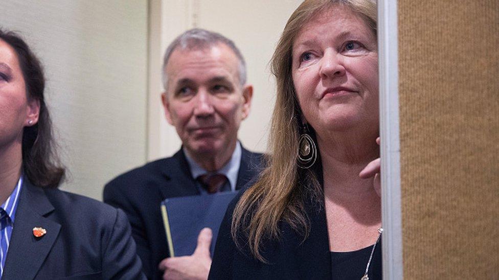 Jane Sanders watches her husband speak during a press conference in South Carolina