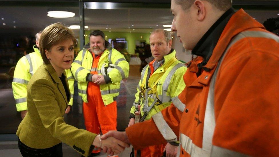 First Minister Nicola Sturgeon talks (left to right) Forth Road Bridge senior engineers Robert McCulloch, Joe Haggerty and rope specialist Jamie McGill as she arrives at the Traffic Scotland control room at South Queensferry