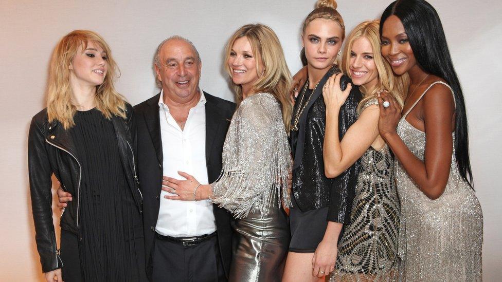 Sir Philip Green with models