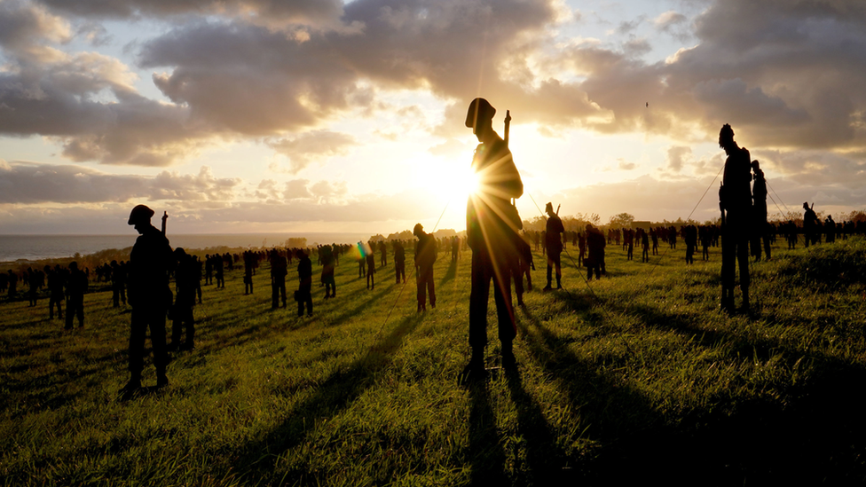 Silhouette figures and sunset