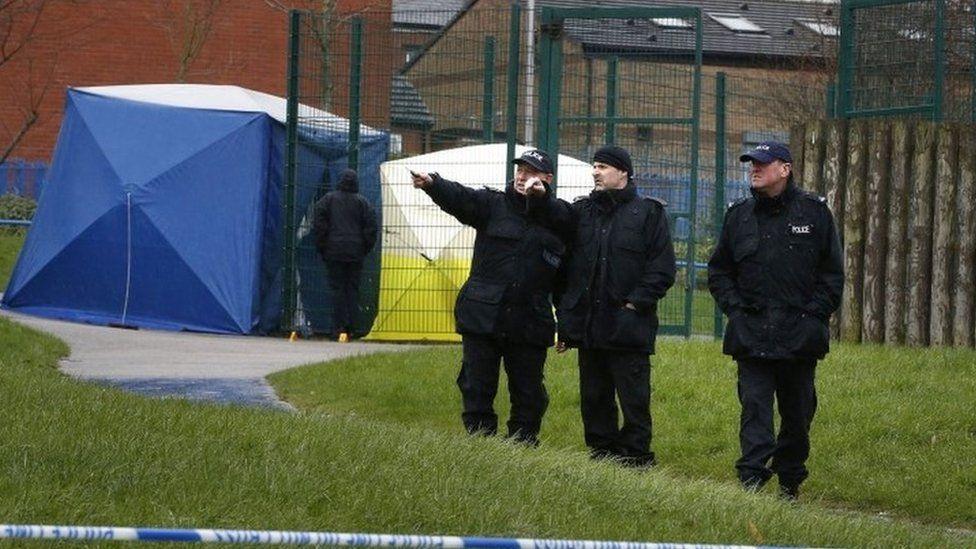 Three police officers in a play area in Rochdale