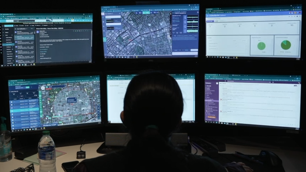 A ShotSpotter analyst at a workstation