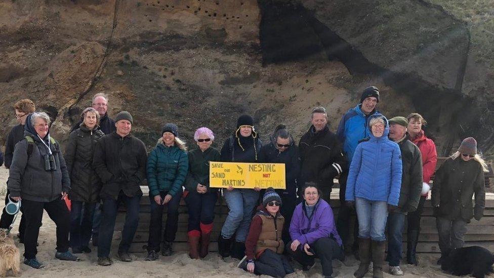 Protestors by the cliffs