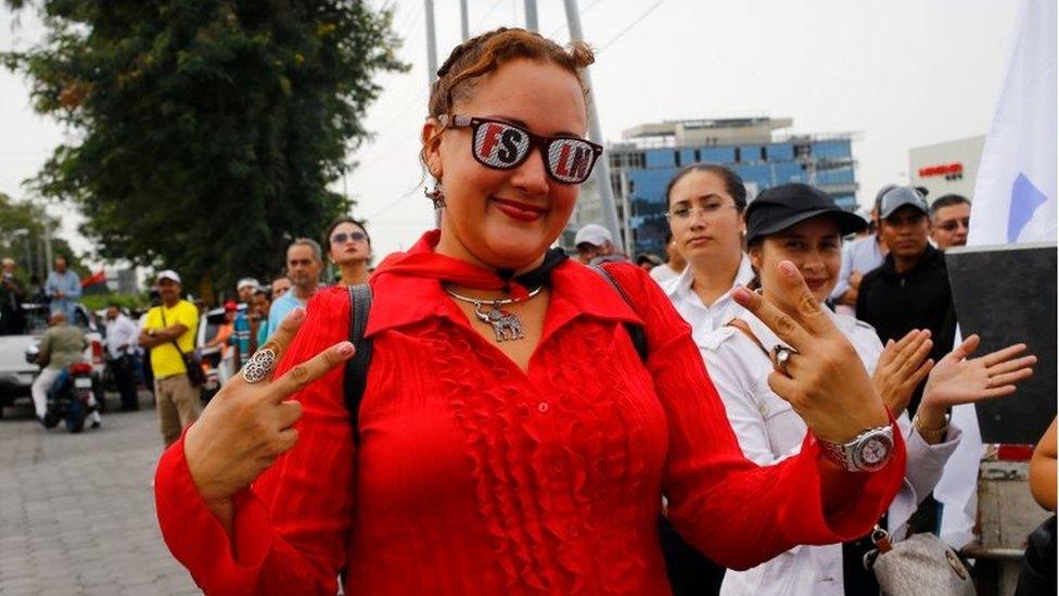 A supporter of Nicaragua's President Daniel Ortega takes part in a march in Managua,