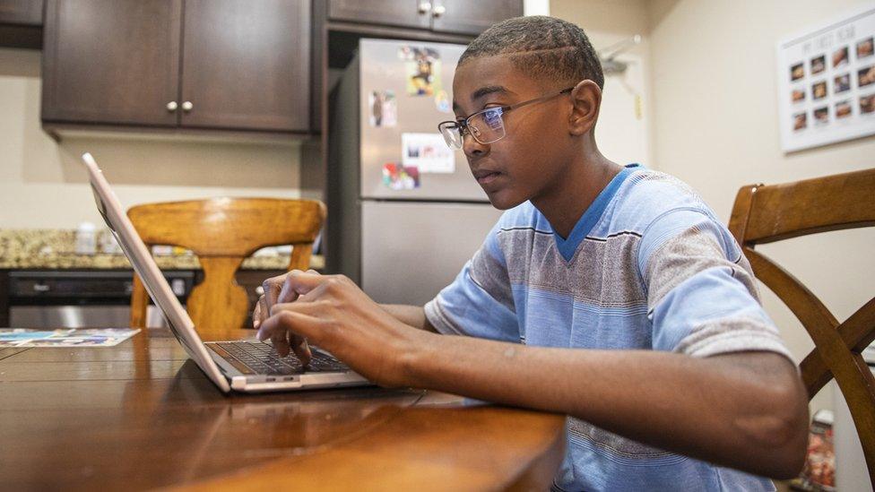 A boy working from home