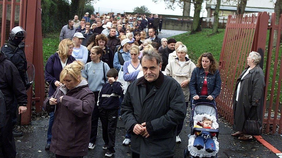 Ardoyne's parish priest at the time, Fr Aidan Troy, helped to escort the schoolgirls to class through violent protests