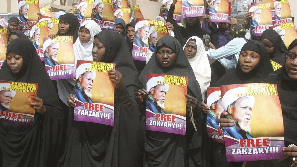 Followers hold posters of Ibrahim Zakzaky during a protest demanding his release, at the offices of the Nigeria Union of Journalists (NUJ) Secretariat, in Kaduna, Nigeria January 5, 2016