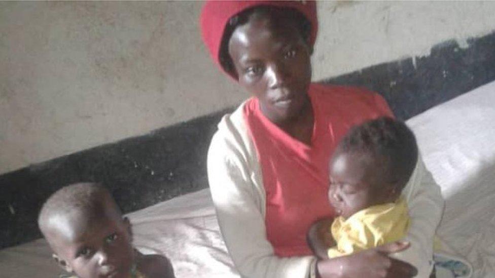 Joseline and her two kids in a school classroom in Uganda's Kasese district where she has taken refuge after the floods