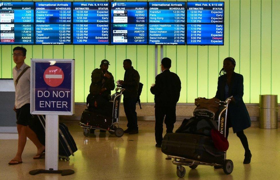 People arrive at the international terminal of Los Angeles International Airport on 8 February, 2017 in Los Angeles, California.