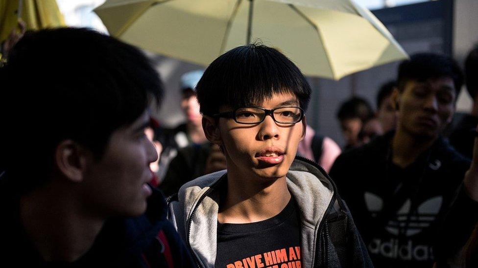 Hong Kong democracy protest leader Joshua Wong arrives at the Hong Kong international airport to see off fellow student leaders Alex Chow, Nathan Law and Eason Chung (not pictured) on their scheduled flight to Beijing on November 15, 2014.