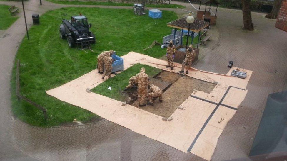 Soldiers remove bench