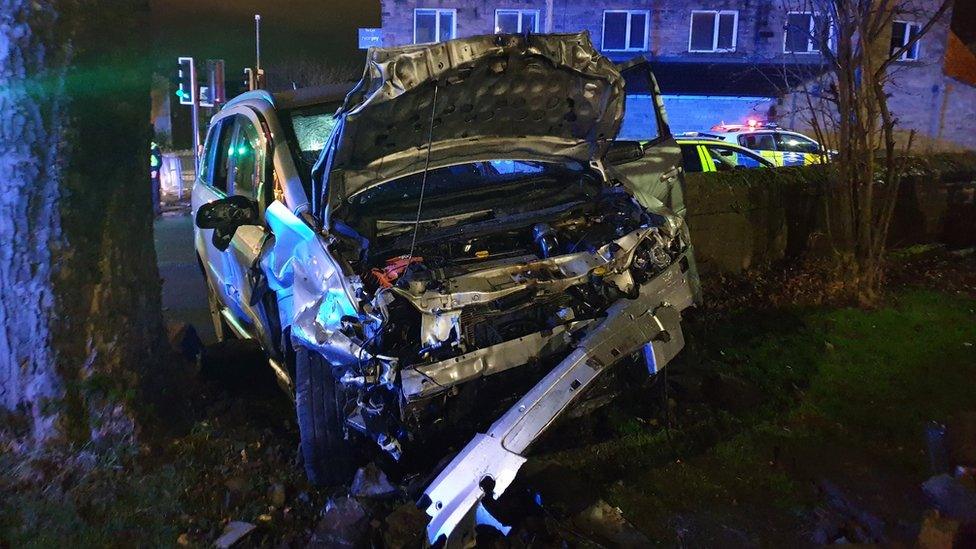 Crashed car in a graveyard