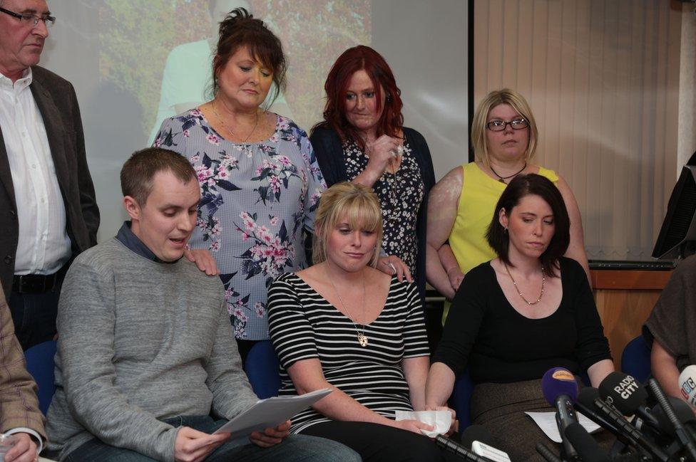 Pc David Phillips' best friend Dave George (front row, left) reads a statement as his family and friends look on including his wife Jen (front, centre) and sister Hannah Whieldon (front row, right) as they attend a press conference at Merseyside Police headquarters