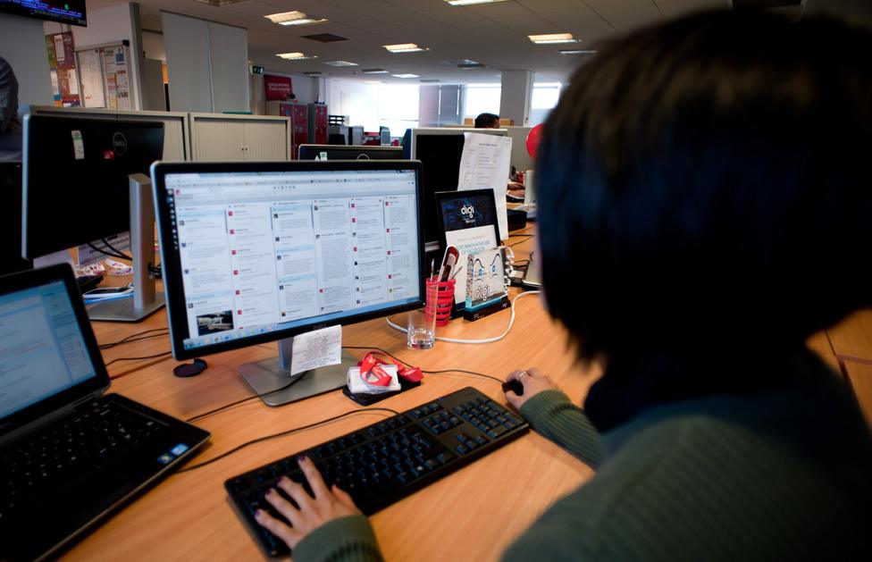 Virgin Trains employee looking at social media