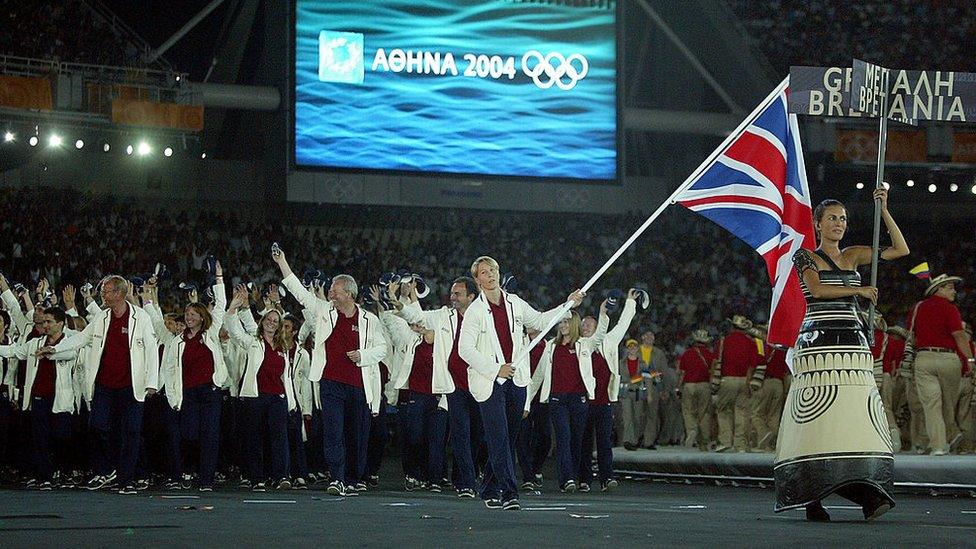 Flag bearer Kate Howey leads the delegation from Great Britain as they walk during the parade of nations, part of the opening ceremonies for the Athens 2004 Summer Olympic Games on August 13, 2004