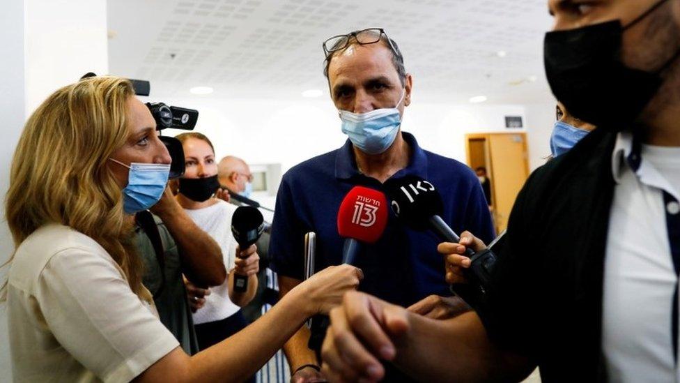 File photo showing Israeli media speaking to Shmulik Peleg outside a court in Tel Aviv, Israel (23 September 2021)