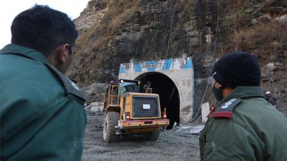 Indian rescuers work near damaged Dhauliganga hydro power project in Chamoli district, Uttrakhand, India, 08 February 2021.