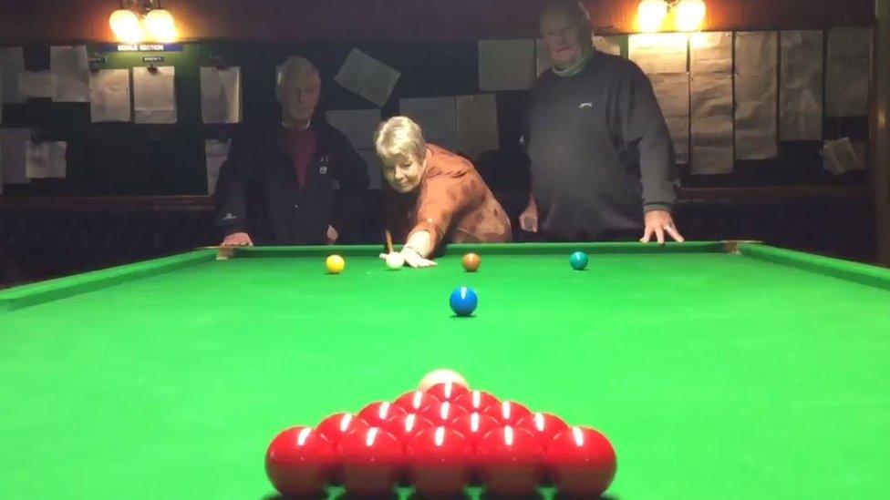 Roy McGunigall, Chairman of Oxton Conservative club, plays snooker with Eileen Newsham