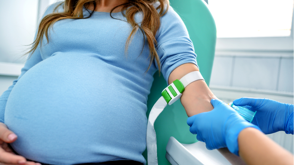 Pregnant woman having a blood test