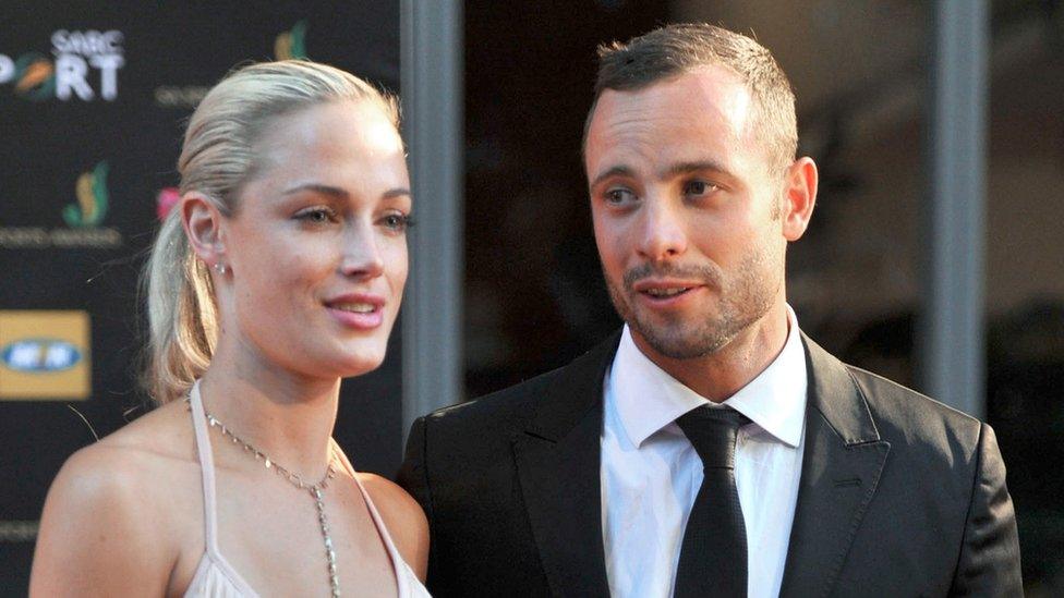 Oscar Pistorius and Reeva Steenkamp pose for cameras