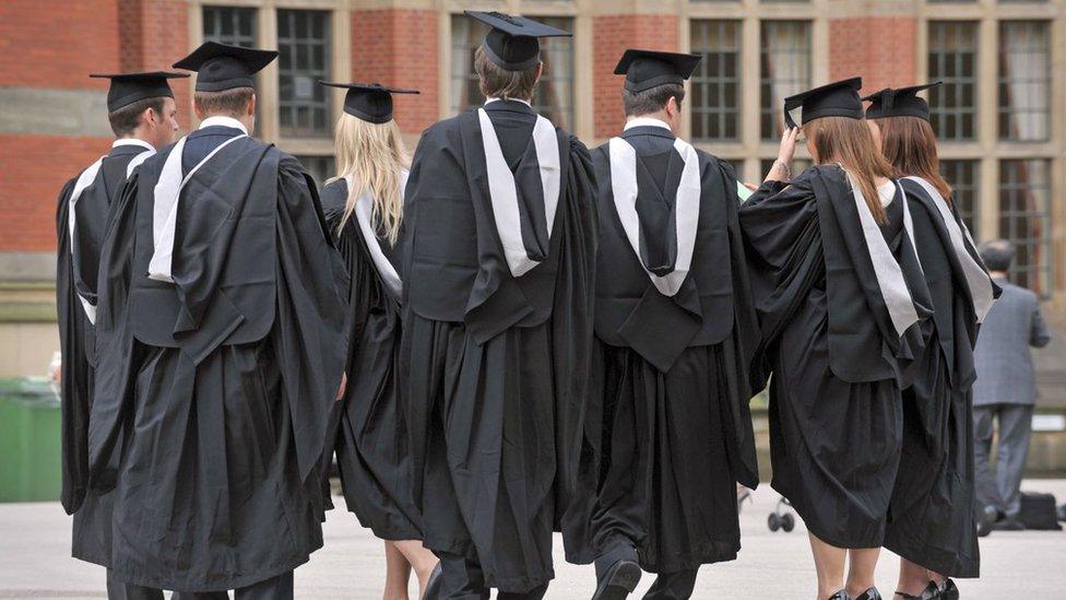 Students in graduation gowns