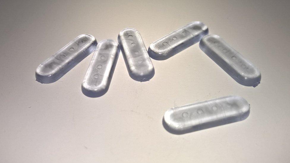 plastic pills with four barcode indentations