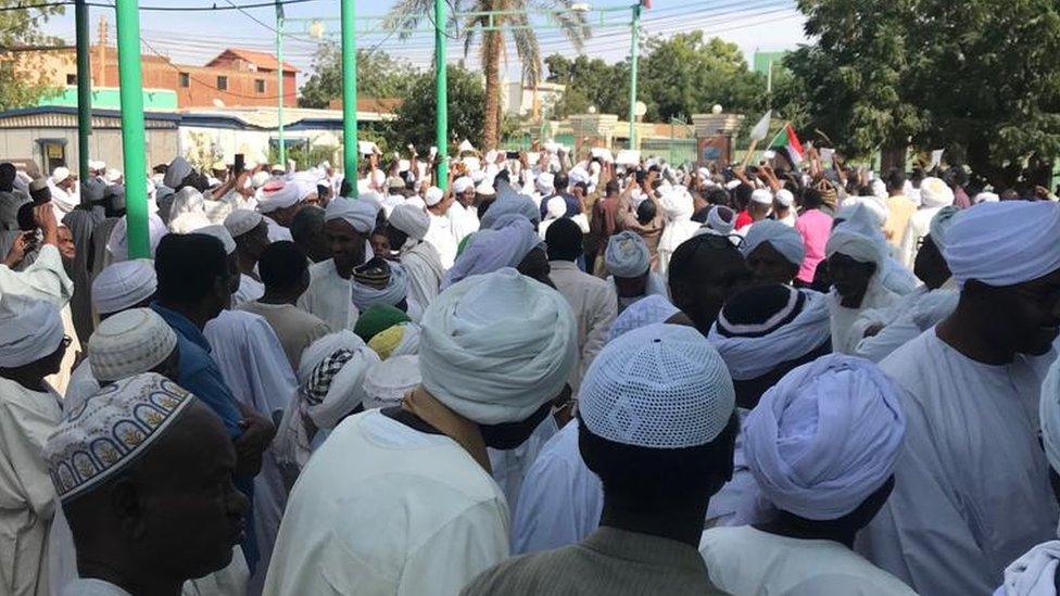 People leave the Sayed Abdelrahman mosque in eastern Omdurman, in the neighbourhood of Wad Nubawi.