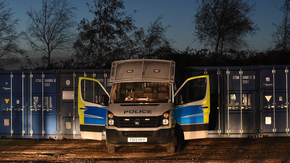 Police van at storage containers in Diseworth