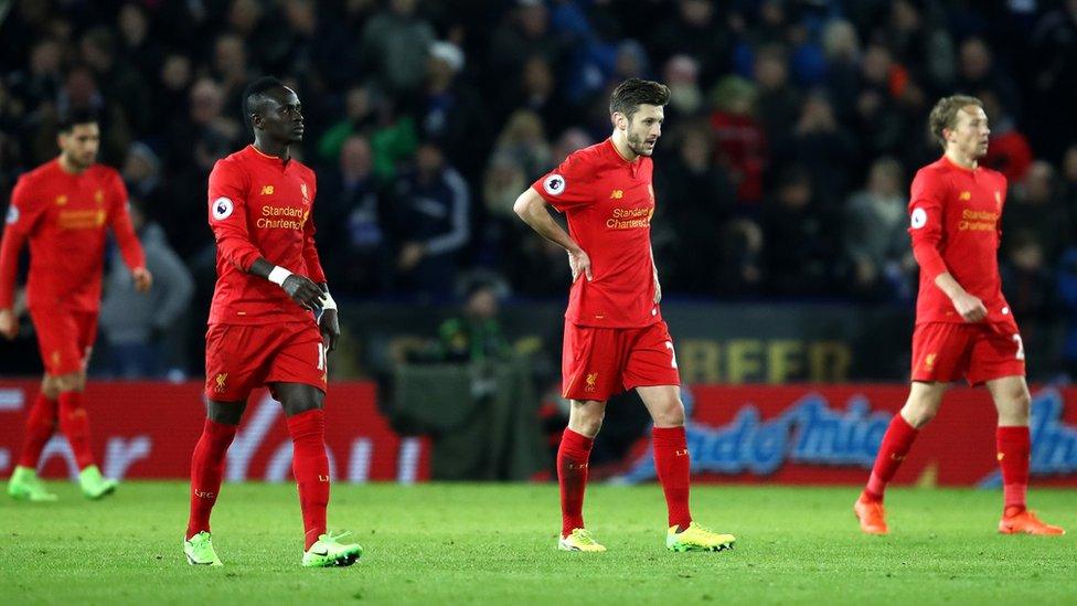 Liverpool players look dejected after losing 3-1 to Leicester City