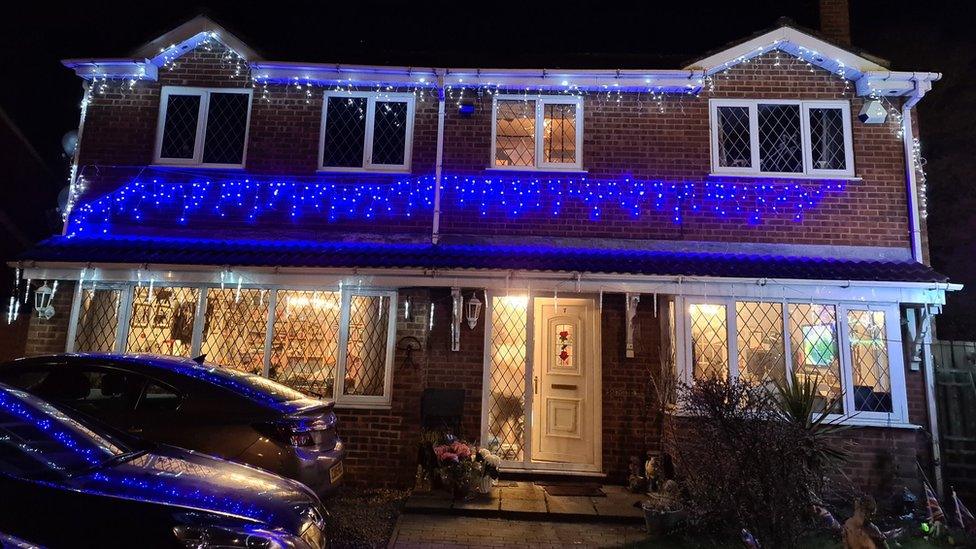 House covered in Christmas decorations during coronavirus outbreak