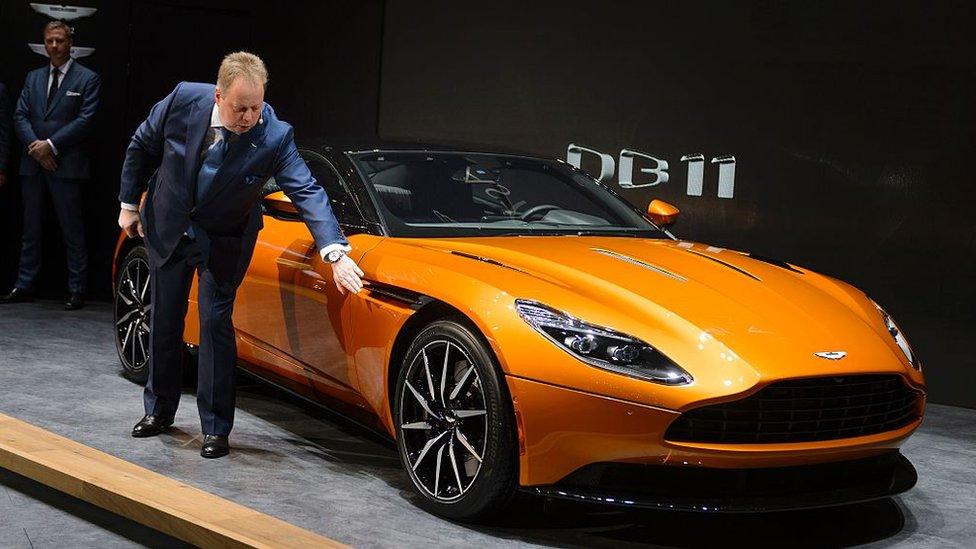 Aston Martin CEO Andy Palmer shows the new DB11