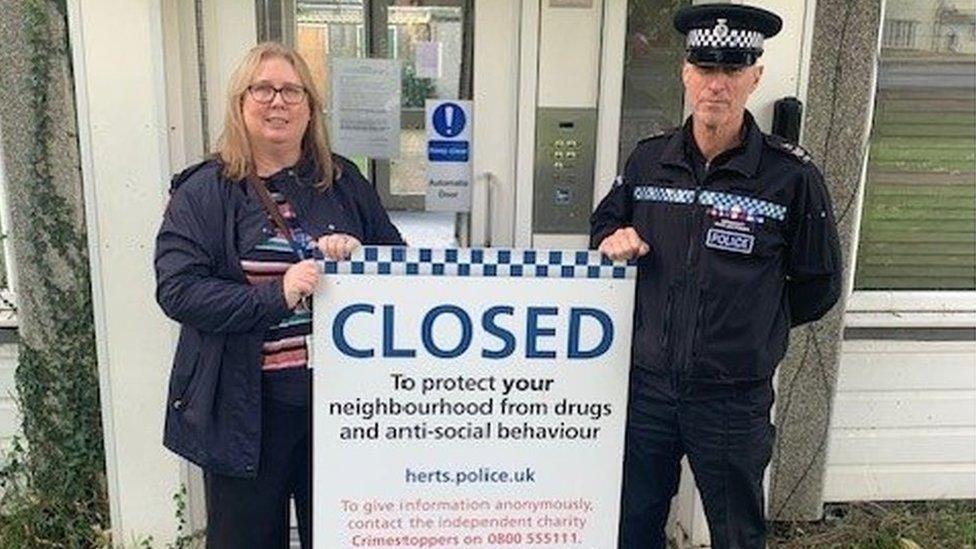 Officers outside the London Colney property