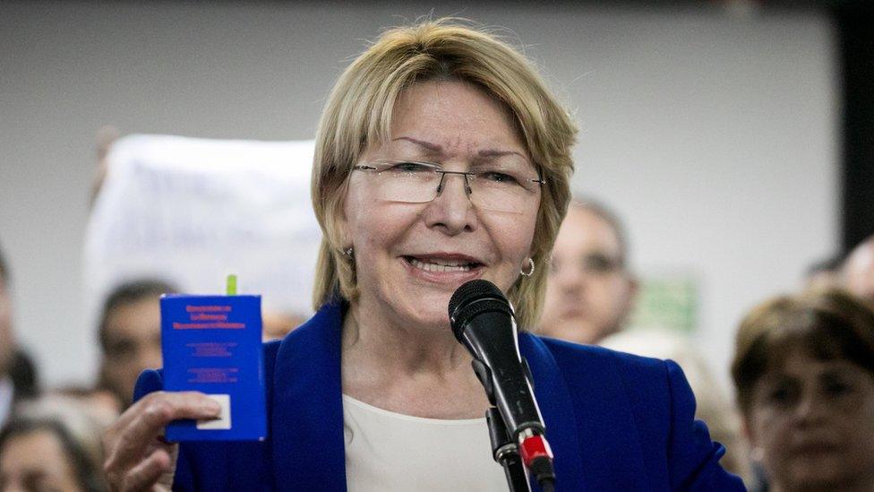 Attorney General Luisa Ortega Díaz addressing supporters on June 19, with the constitution in hand