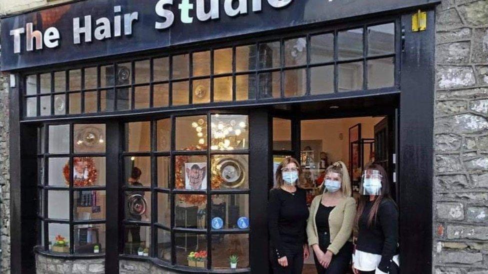 Jacquie and two of her team outside her shop