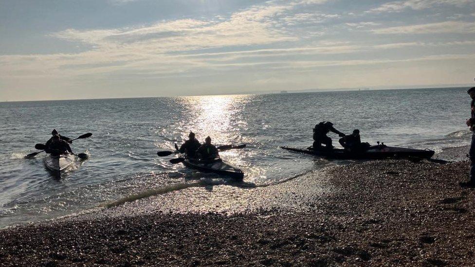 Beach with kayaks launching