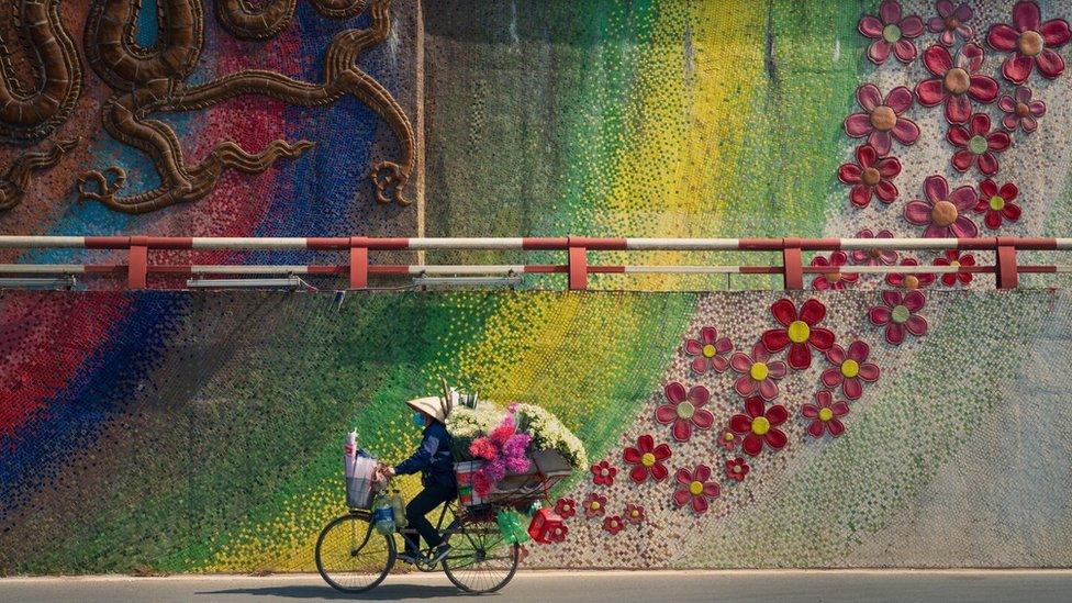 This colourful display shows a street in Hanoi, in Vietnam.