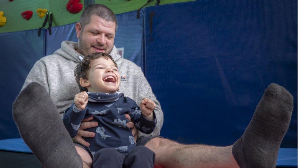 Parents and son playing