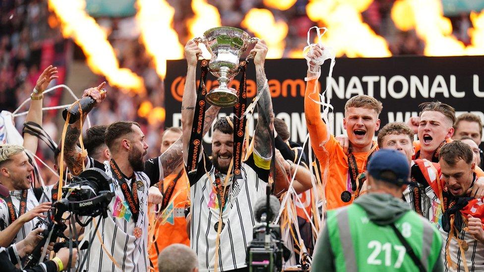 Notts County players celebrating promotion