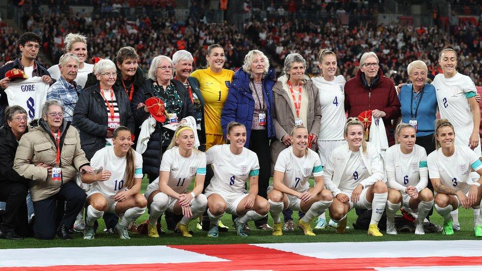 The 1972 England Women's team being presented with their shirts