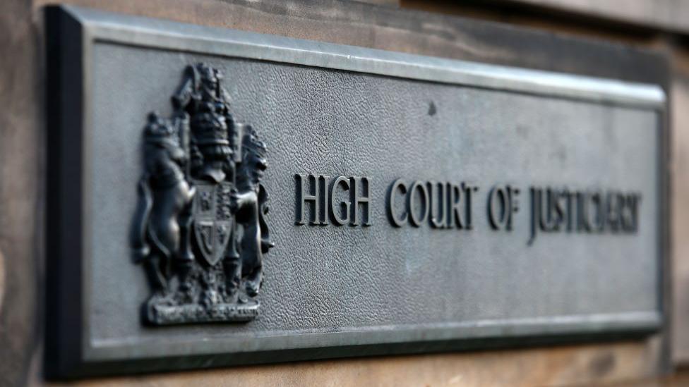 Sign outside the High Court in Edinburgh which says High Court of Justiciary.
