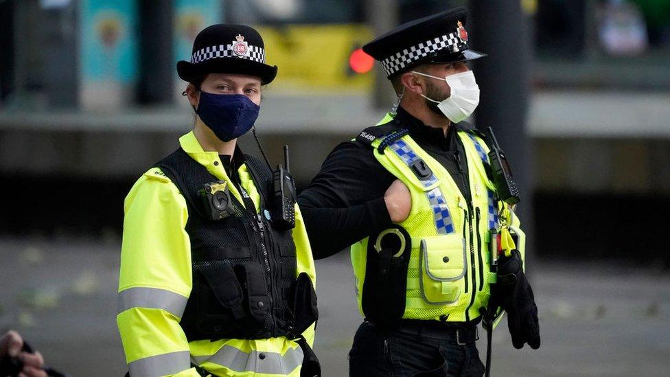 Police officers wearing face masks