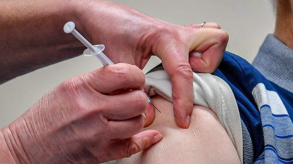 A patient receives the Astra Zeneca/Oxford University Covid-19 vaccine in Merthyr Tydfil