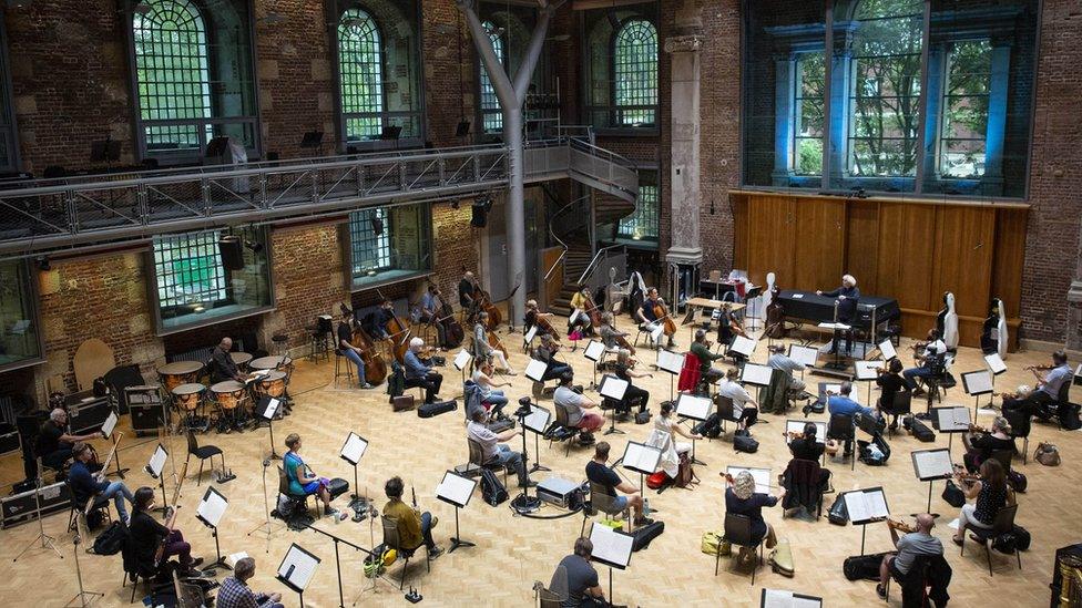 Sir Simon Rattle rehearsing with the London Symphony Orchestra at LSO St Luke's in London in August