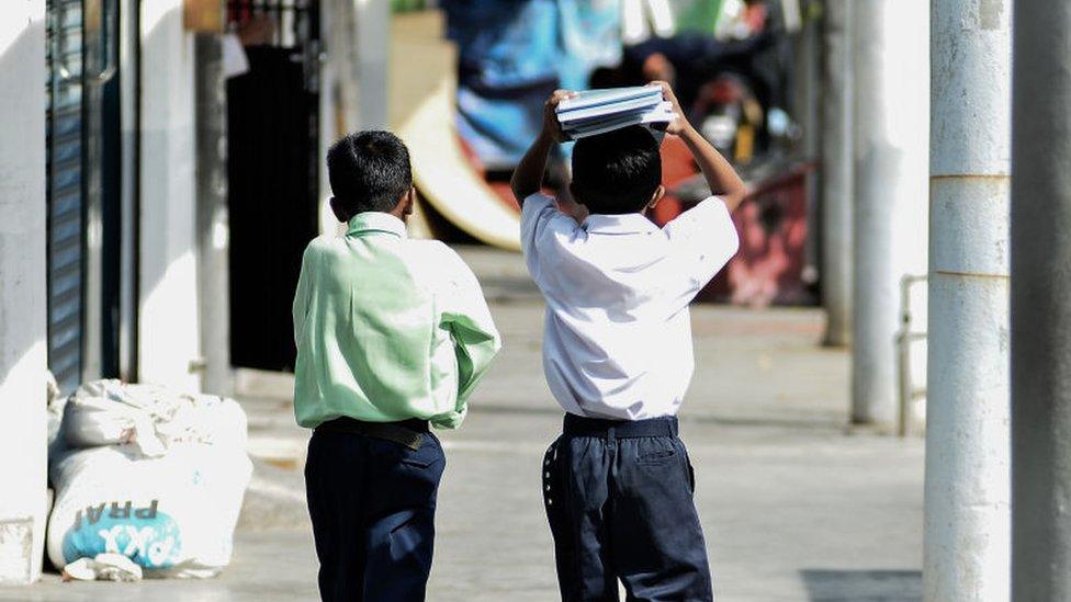 Picture of students with textbooks