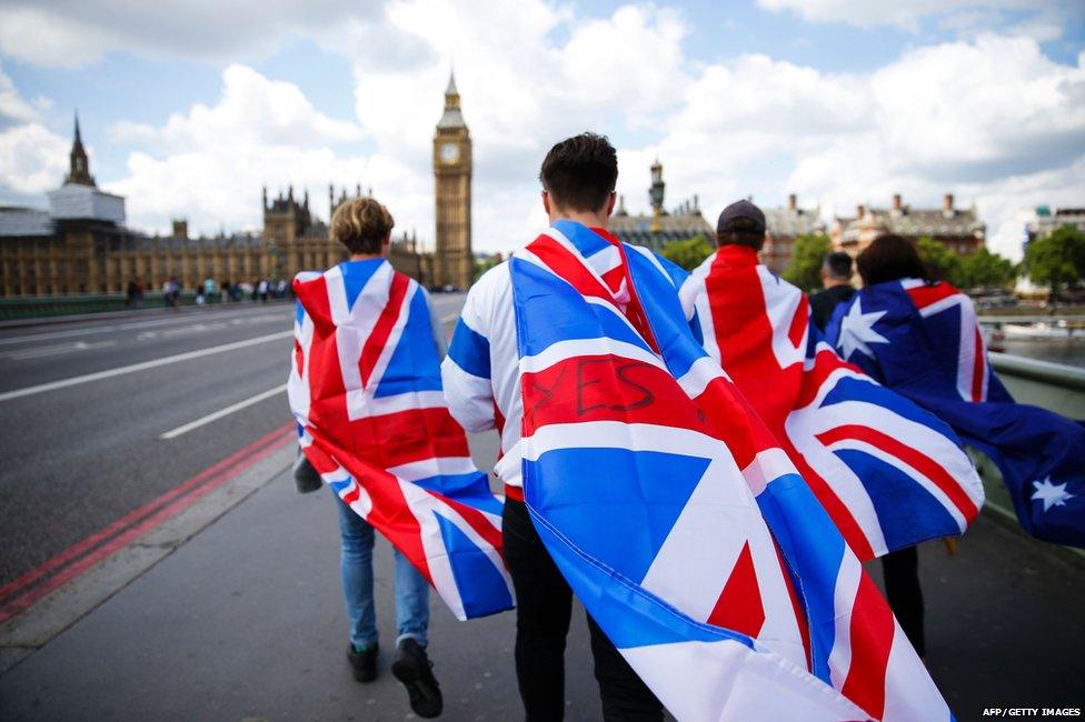 People with union flags on Westminster Bridge