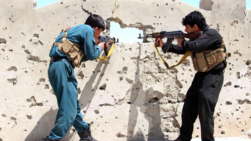 Members of the Afghan security forces take position during an operation against Taliban fighters in Nad Ali district of Helmand province, Afghanistan on 8 April 2017